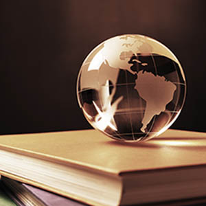 globe of the world on a stack of books
