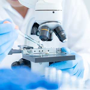 microscope biotech scientist